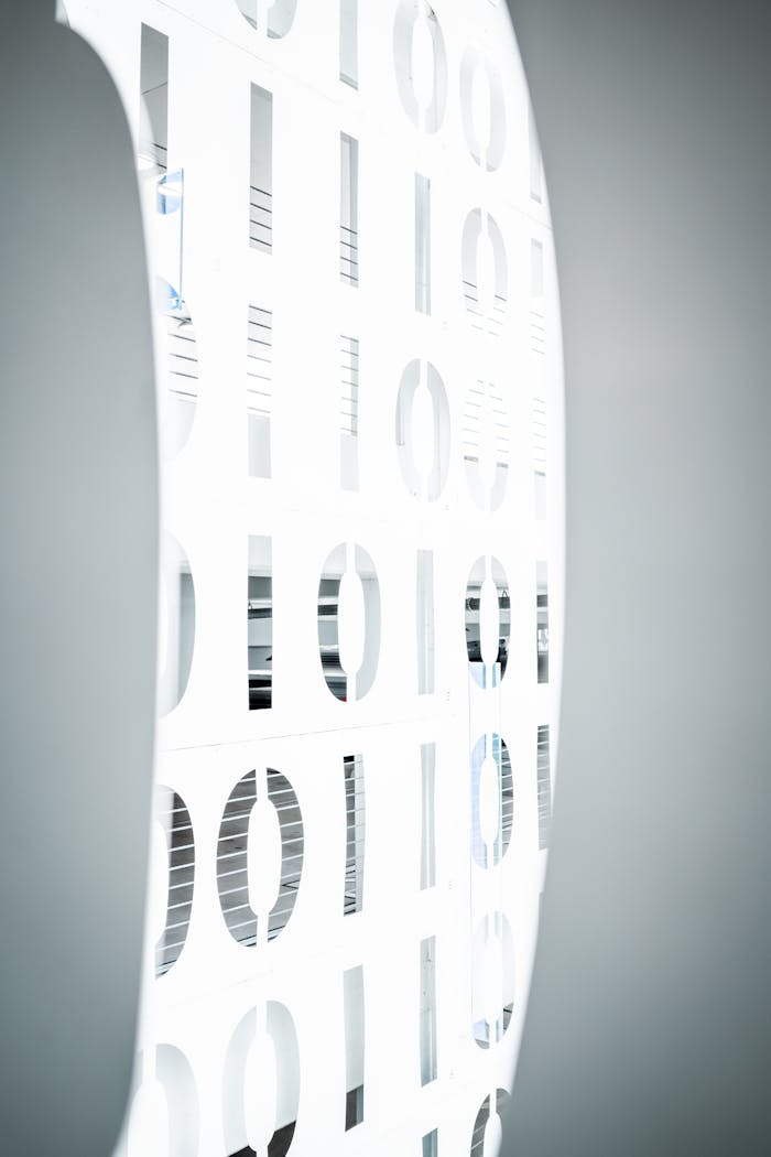 services-04 Stylish interior office design featuring an illuminated binary pattern wall, symbolizing modern digital communication.